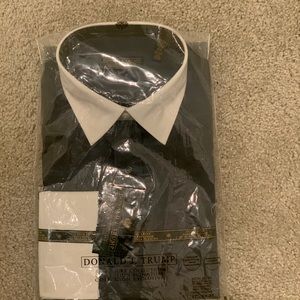 Brand new Donald Trump dress shirt in black. Has tags and still in the bag.
